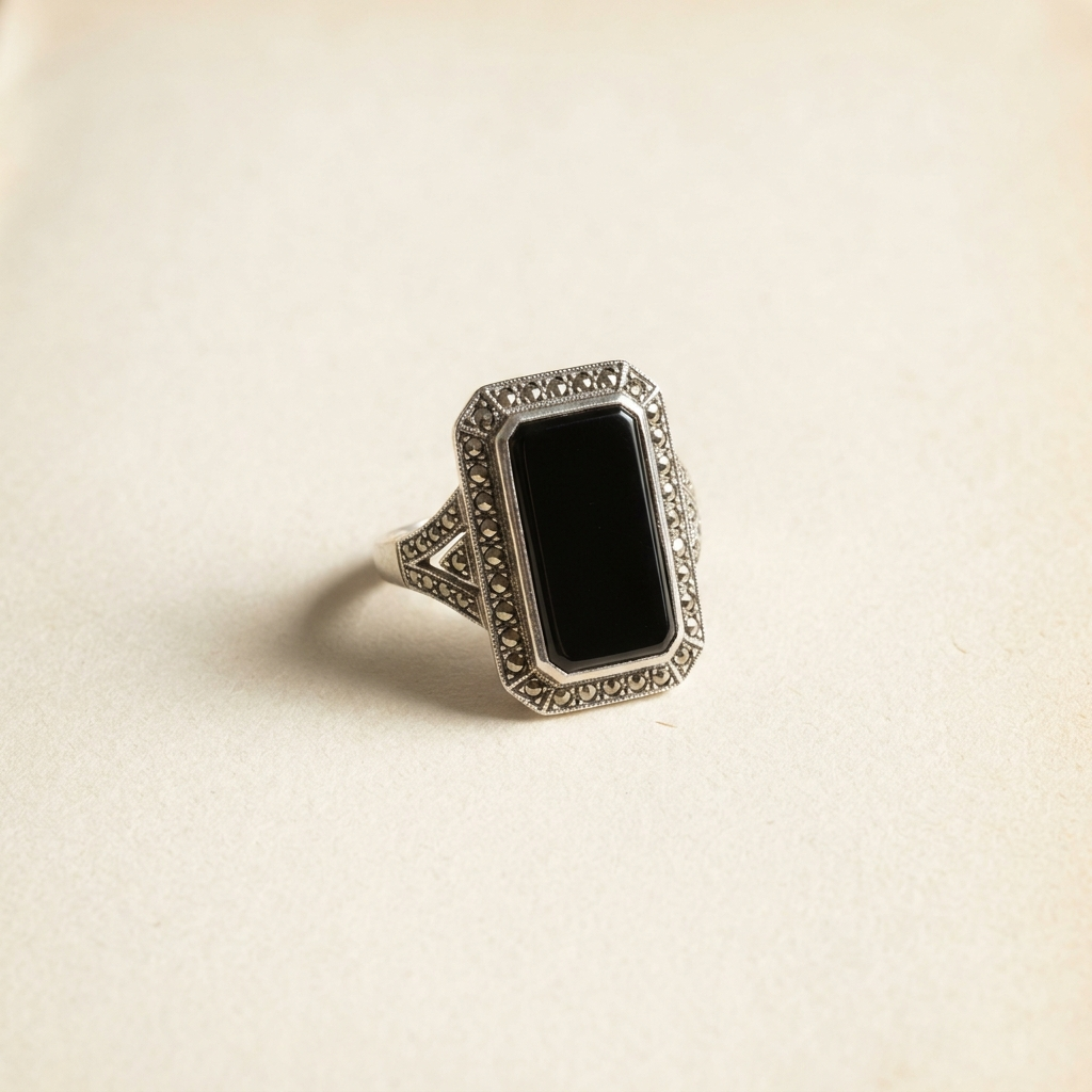 Art Deco marcasite and onyx cocktail ring on paper