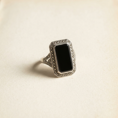 Art Deco marcasite and onyx cocktail ring on paper
